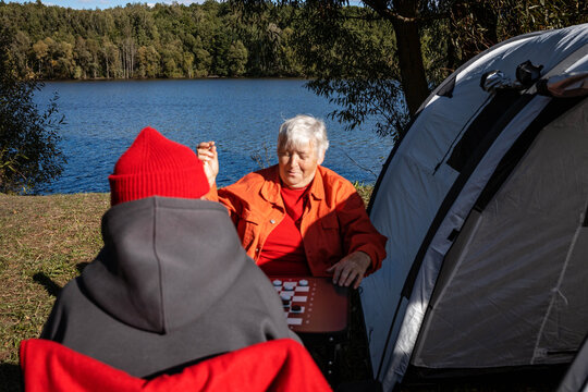 Playing checkers outdoors.