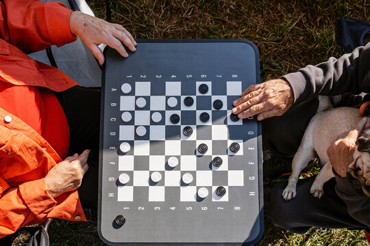 Playing checkers.
