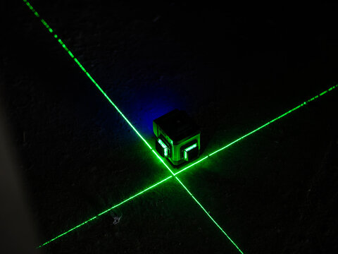 Green Laser Level on Concrete Floor