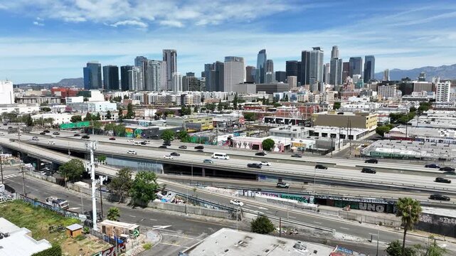 Los Angeles, California, USA - Drone Aerial View of Downtown LA Urban Skyline With High Rise Buildings and Graffiti Highway