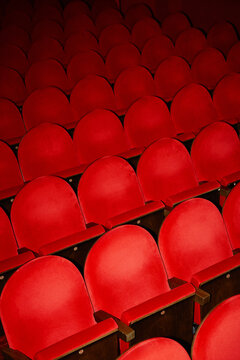 Red chairs in the theater waiting for the show to start