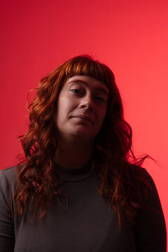 Redhead Portrait on Red Background
