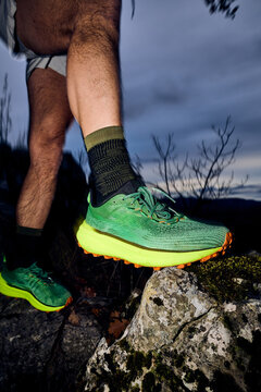 Man sets foot on the rock in nature