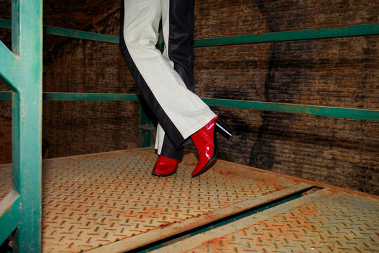 Fashion Shoes Are Worn on a Metal Platform 