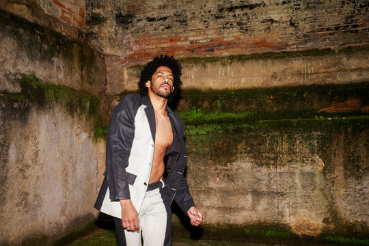 Young Man Dances in an Urban Location During the Night