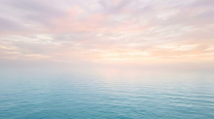 Fototapeta premium A serene ocean scene at sunrise with calm water and cloudy sky