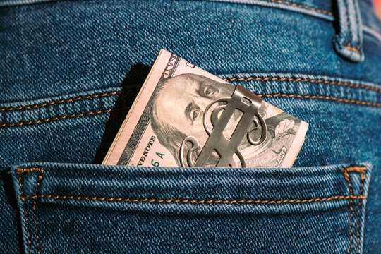 Close-up of dollars in Blue Denim Jeans Pocket