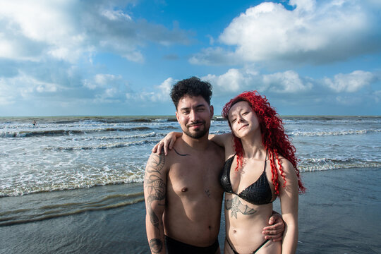 Friends Stand Together by the Sea Enjoying a Sunny Day