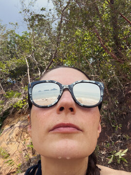 selfie of a woman in reflective sunglasses