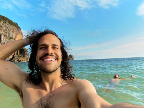 Man taking selfie while swimming at Railay Beach