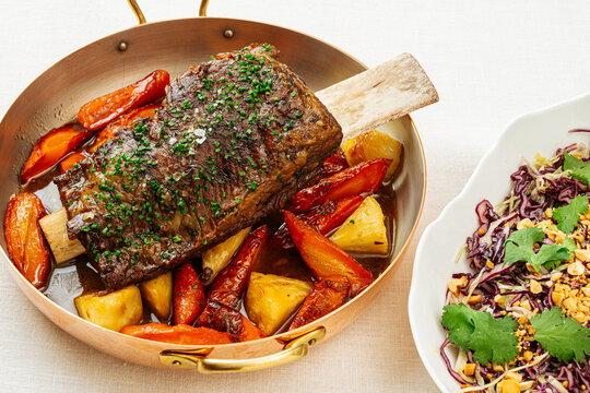 Braised beef short rib with roasted vegetables and cabbage salad