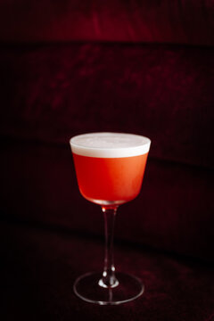 Red Cocktail with Foam in Stemmed Glass