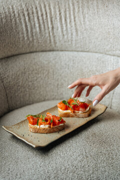 Smoked salmon bruschetta on ceramic plate