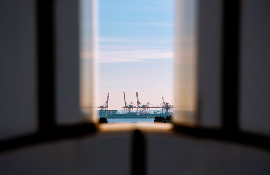 Distant Trade Port and Quay Cranes within a Framed Composition.