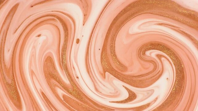 Soft swirls dance in warm peach and cream hues. Golden specks shimmer through flowing, fluid patterns. Organic motion creates a calming, swirling abstract design. Ideal for backgrounds