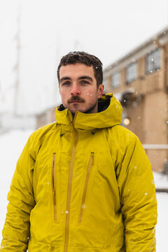 Portrait of a Determined Man in Yellow Winter Gear Outdoors