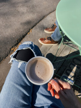 POV Drinking Chai Latte Outdoors Cafe New Orleans