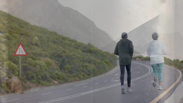 Senior couple starting run for health, camera tracking winding road while film scratches overlaying