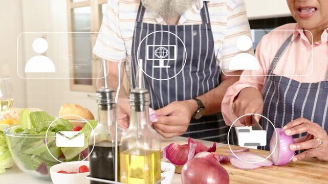 App icons appearing and fading while mature couple peeling and slicing onions, preparing salad