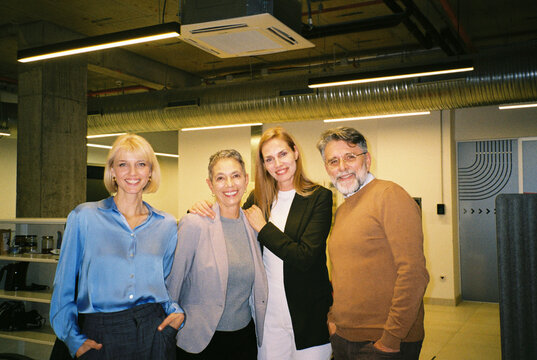 Group photo of smiling colleagues