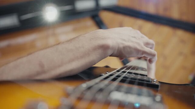 POV of man hands playing electro guitar