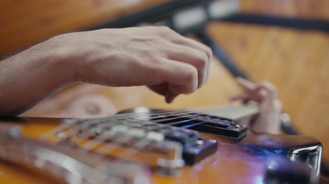 POV of man hands playing electro guitar