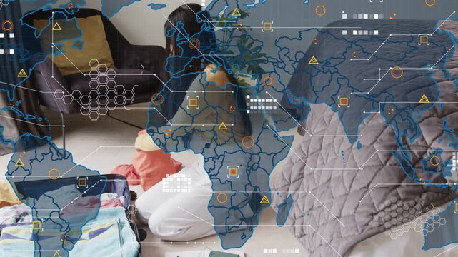 Traveler kneeling, finishing notes then packing suitcase for trip while HUD map overlaying her