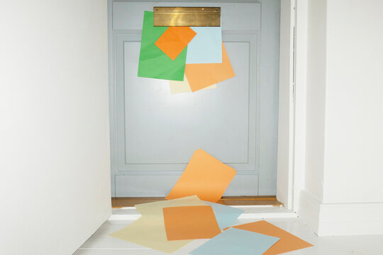 Door with mailbox and lots of colourful letters and mails with flash