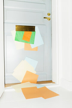 Door with mailbox and lots of colourful letters and mails with flash