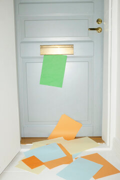 Door with mailbox and lots of colourful letters and mails with flash