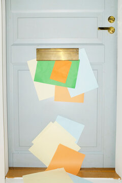 Door with mailbox and lots of colourful letters and mails with flash
