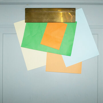 Door with mailbox and lots of colourful letters and mails with flash