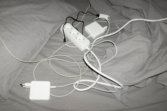 Contemporary electronic technology wires and charges on bed sheets