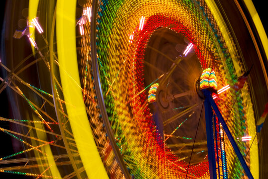 Time exposure carousel wheel spinning night digital capture