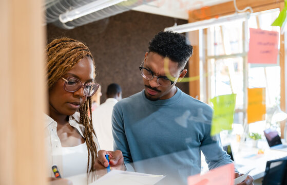 Focused colleagues collaborating on a project