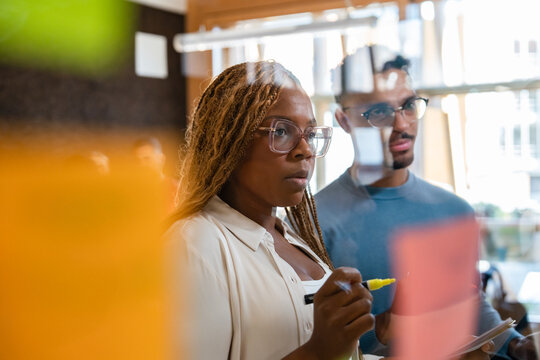 Focused team brainstorming in modern office