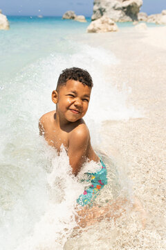 Young child caching waves at the beach