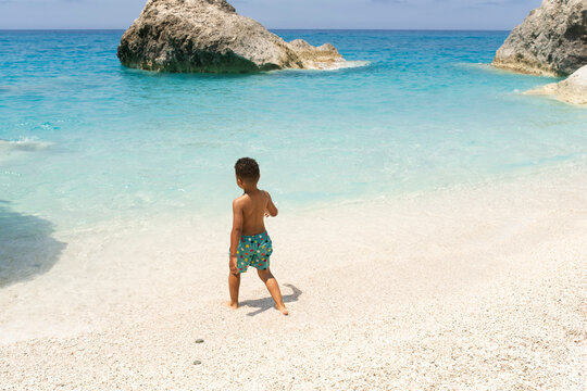 Young child caching waves at the beach