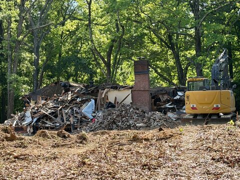 Old house structure knockdown tear down demolition for redevelopment