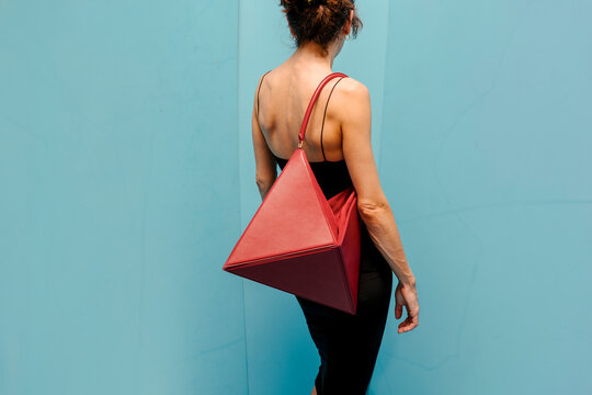 Geometric Red Bag On Person In Black Dress