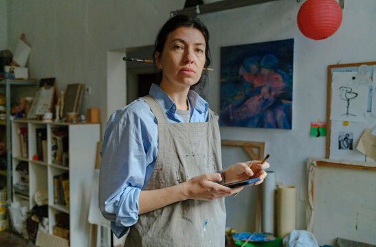 portrait of a female artist in her studio