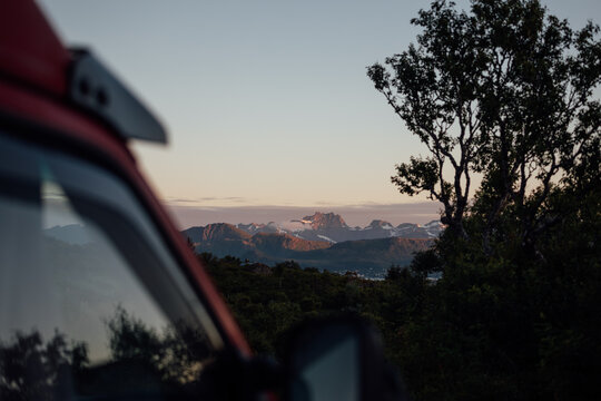 Enjoying the scenic lofoten sunset during a camper van road trip