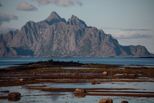 Lofoten mountains rising above coastline and tidal flats