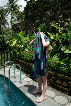 Relaxing in Nature by the Pool While Drying off in the Sun