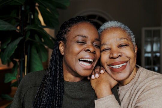 Mother and daughter sharing a joyful moment at home