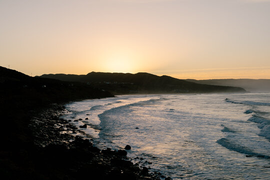 Ocean waves breaking along the coast of Morocco at sunset