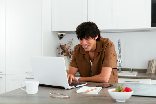 Modern man working on a laptop from home