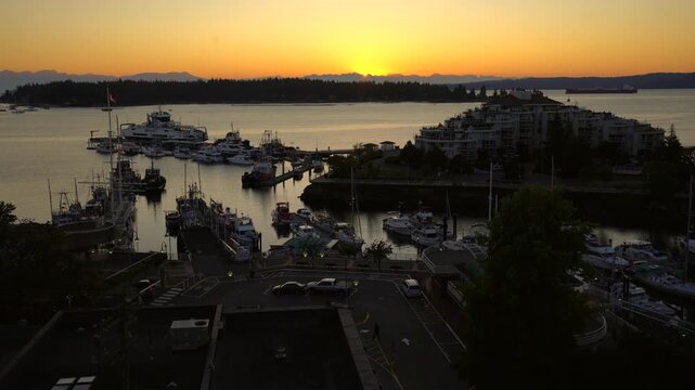 Nanaimo Harbor Dawn British Columbia Canada 4K UHD. Sunrise over the harbor and marina at dawn in downtown Nanaimo, British Columbia, Canada. 4K, UHD.
