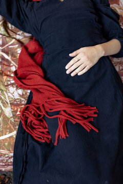 portrait of a young woman in a red scarf