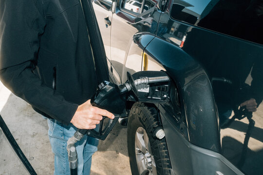 Pumping Gas at Gas Station